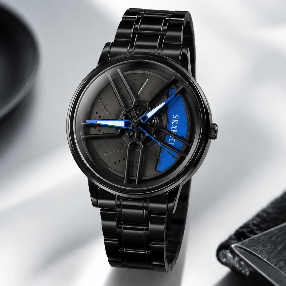 A black metal wristwatch with a matching black link bracelet, featuring a dark gray skeleton-style dial with bright blue hands and a blue accent section. The brand name 'AVYS' is visible on the dial.